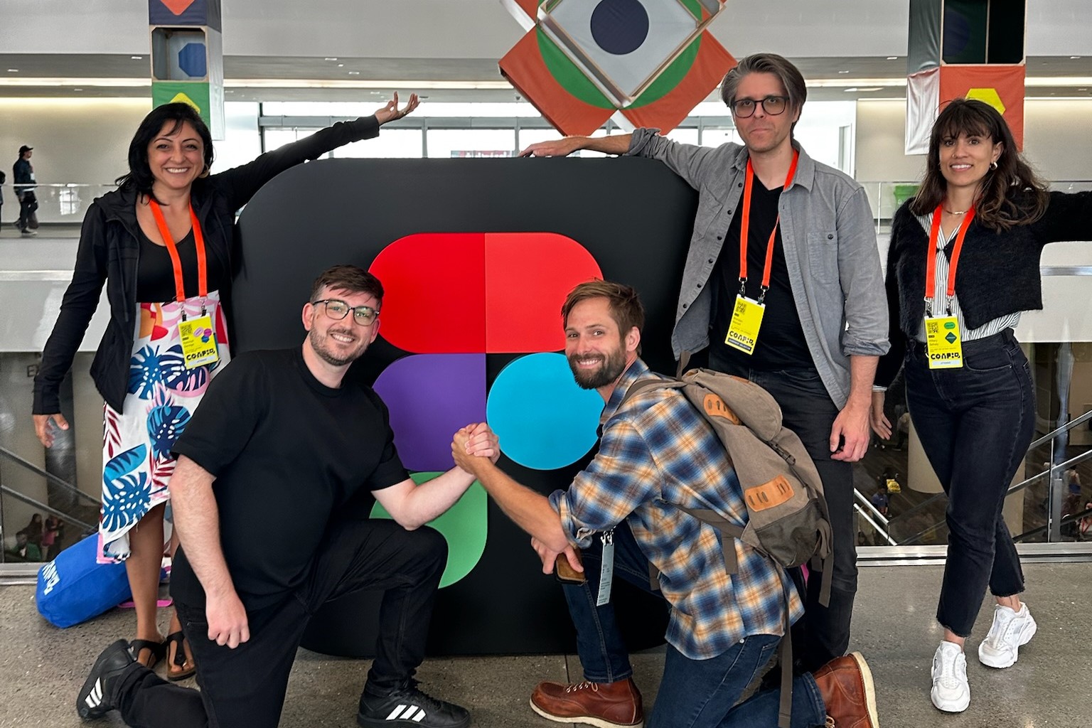 Cvent design system team gathered around a large Figma mark
